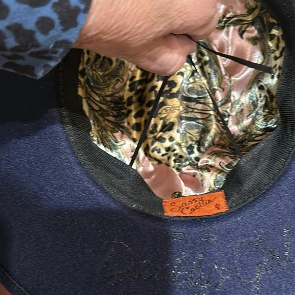 New. Absolutely gorgeous adjustable hat. So much detailing 